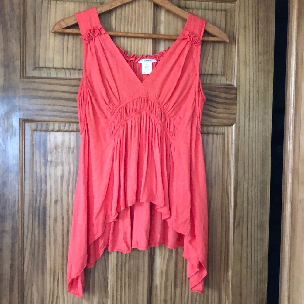 Beautiful sleeveless summer blouse in coral